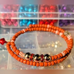 Handmade red and silver memory wire charm bracelet